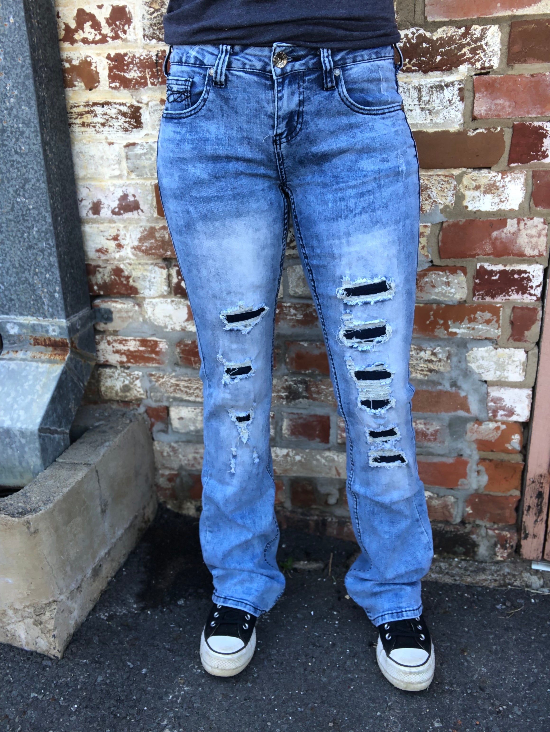 Ripped jeans store with cloth underneath